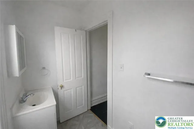 a bathroom with a sink and a vanity