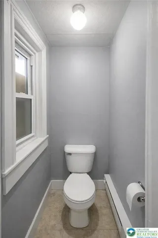 a bathroom with a toilet and a sink