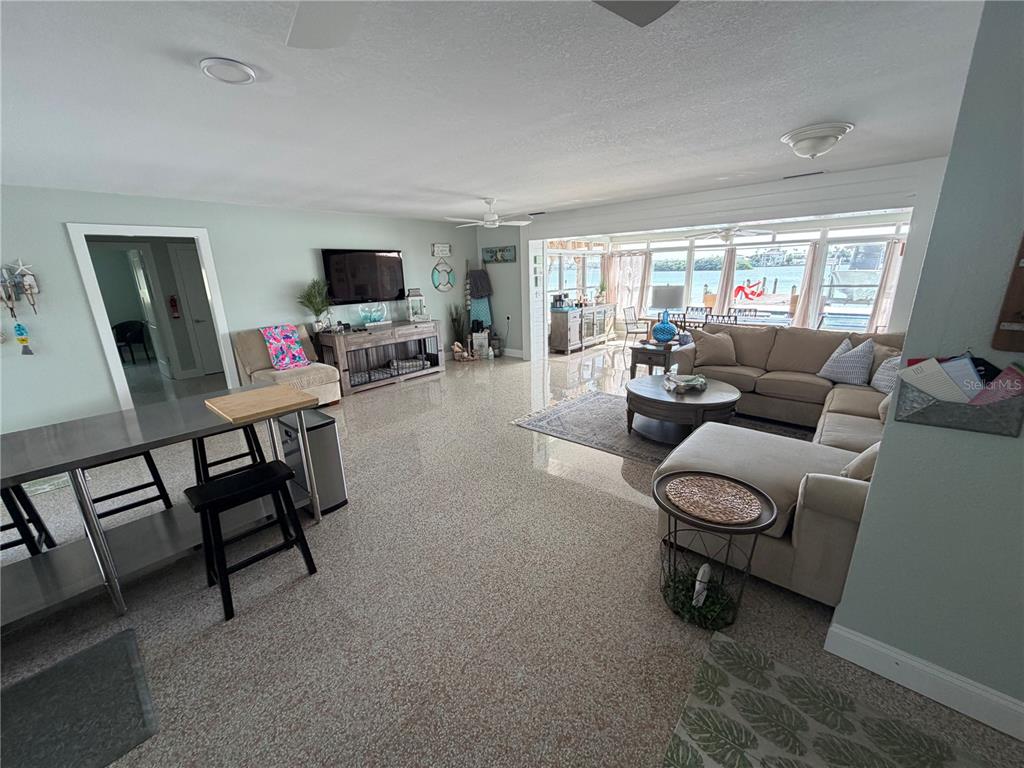 433 20th Avenue Indian Rocks Beach, FL 33785 - Photo 14 of 23 a living room with furniture and a flat screen tv