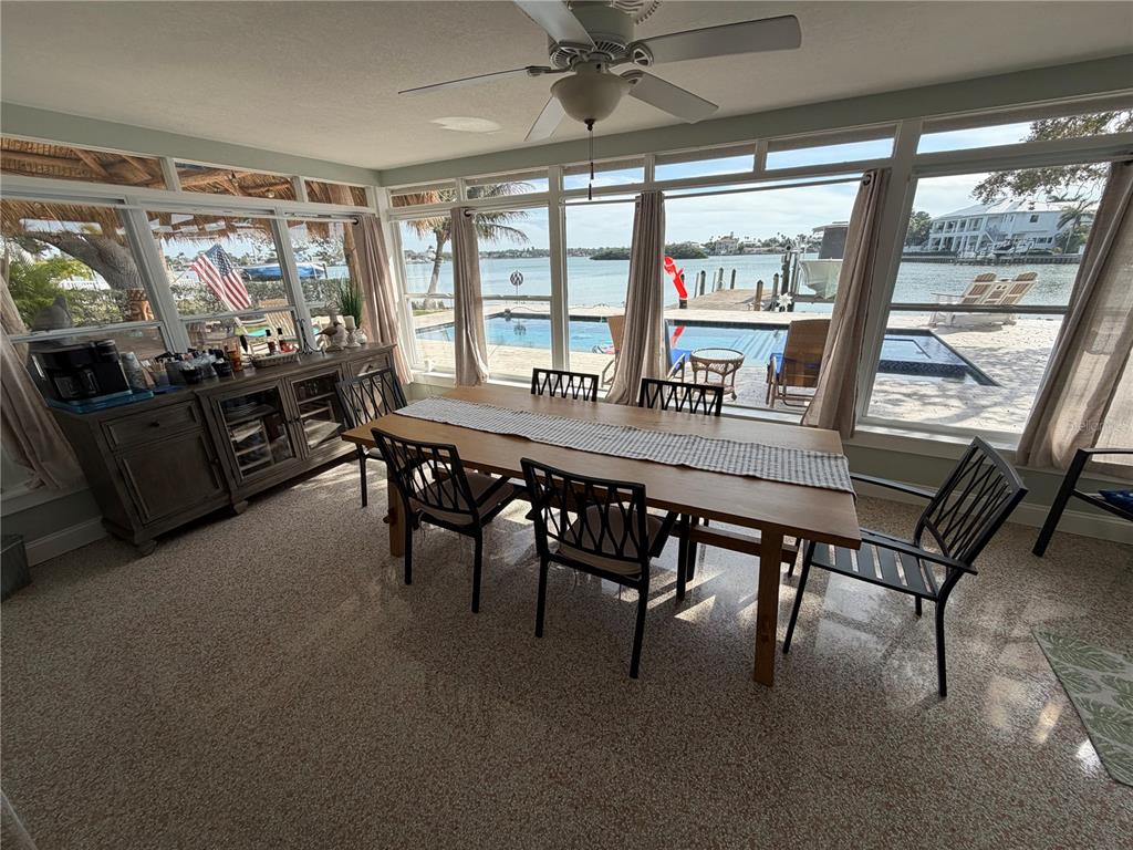 433 20th Avenue Indian Rocks Beach, FL 33785 - Photo 18 of 23 a dining hall with furniture a window and a flat screen tv