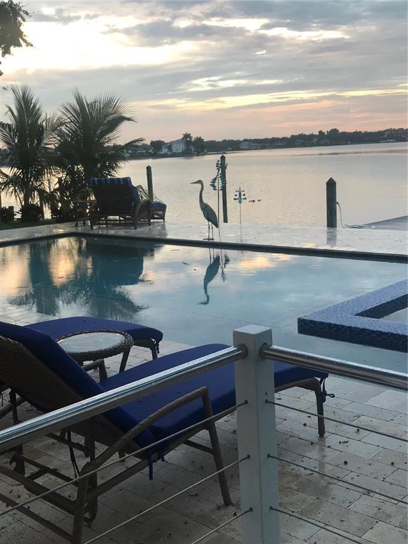 433 20th Avenue Indian Rocks Beach, FL 33785 - Photo 22 of 23 a view of a lake with couches chairs and ocean view