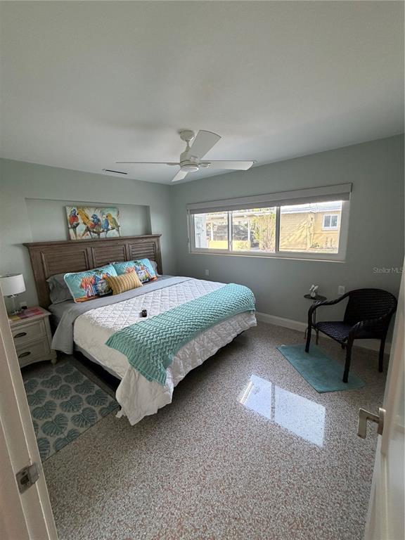 433 20th Avenue Indian Rocks Beach, FL 33785 - Photo 3 of 23 a bedroom with a bed chair and a window