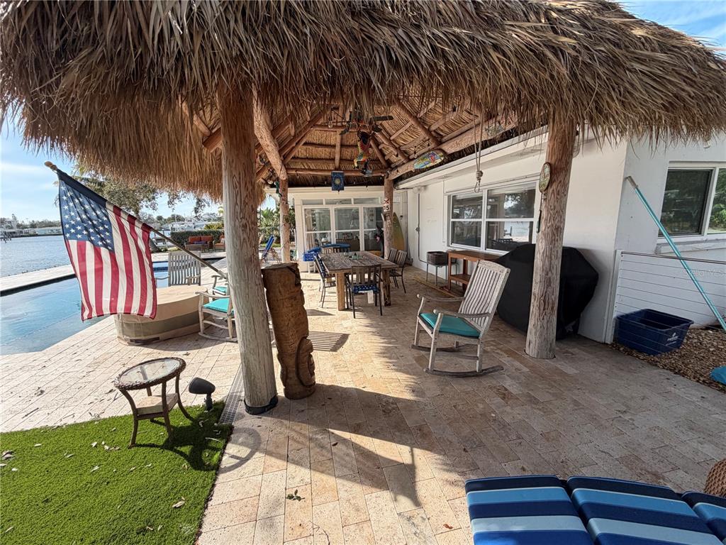 433 20th Avenue Indian Rocks Beach, FL 33785 - Photo 10 of 23 a building outdoor space with patio furniture and potted plants