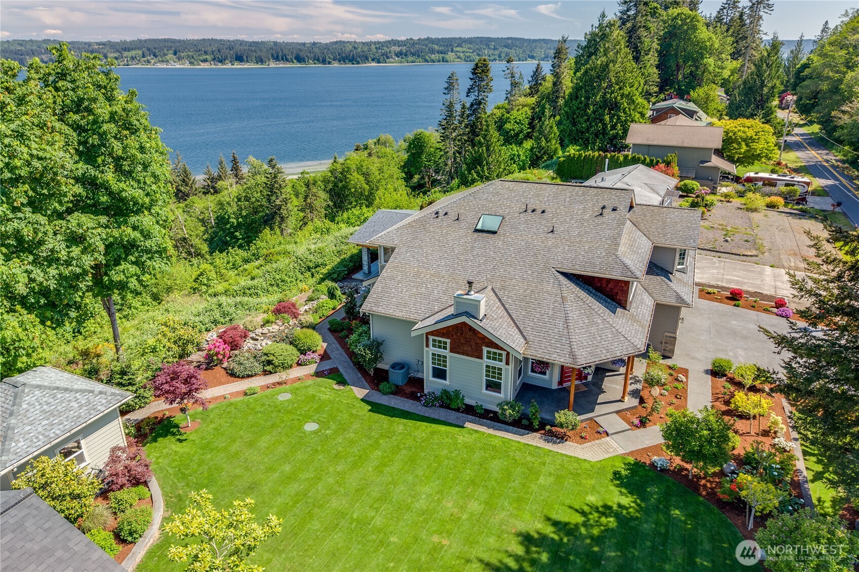 1411 Thorndyke Road Port Ludlow, WA 98365 - Photo 40 of 40 an aerial view of a house with a garden and swimming pool