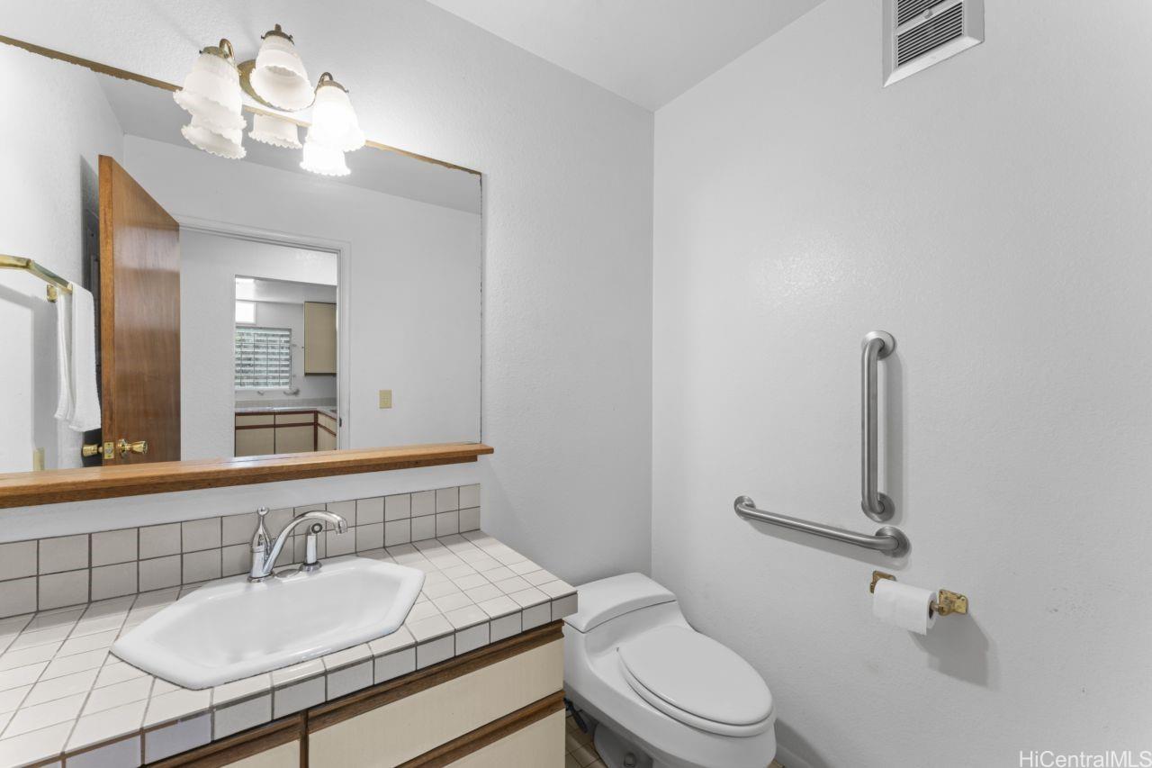 47-800 Ahuimanu Road Kaneohe, HI 96744 - Photo 7 of 25 Half Bath just inside of garage house entry
