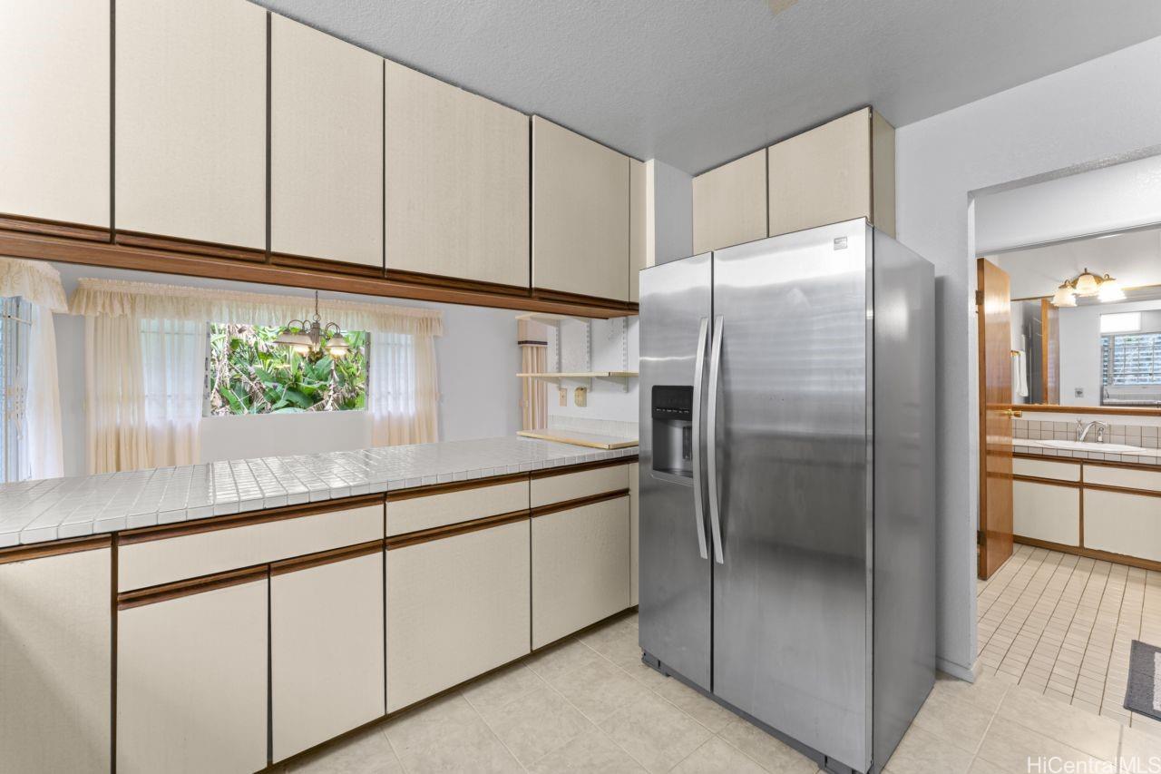 47-800 Ahuimanu Road Kaneohe, HI 96744 - Photo 8 of 25 Kitchen facing hallway and half bath