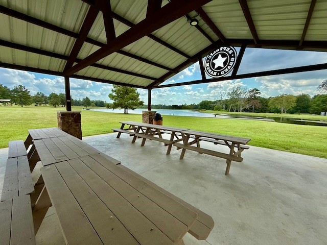 10769 Ruger Road Willis, TX 77378 - Photo 18 of 19 a view of a swimming pool with a table and chairs in patio
