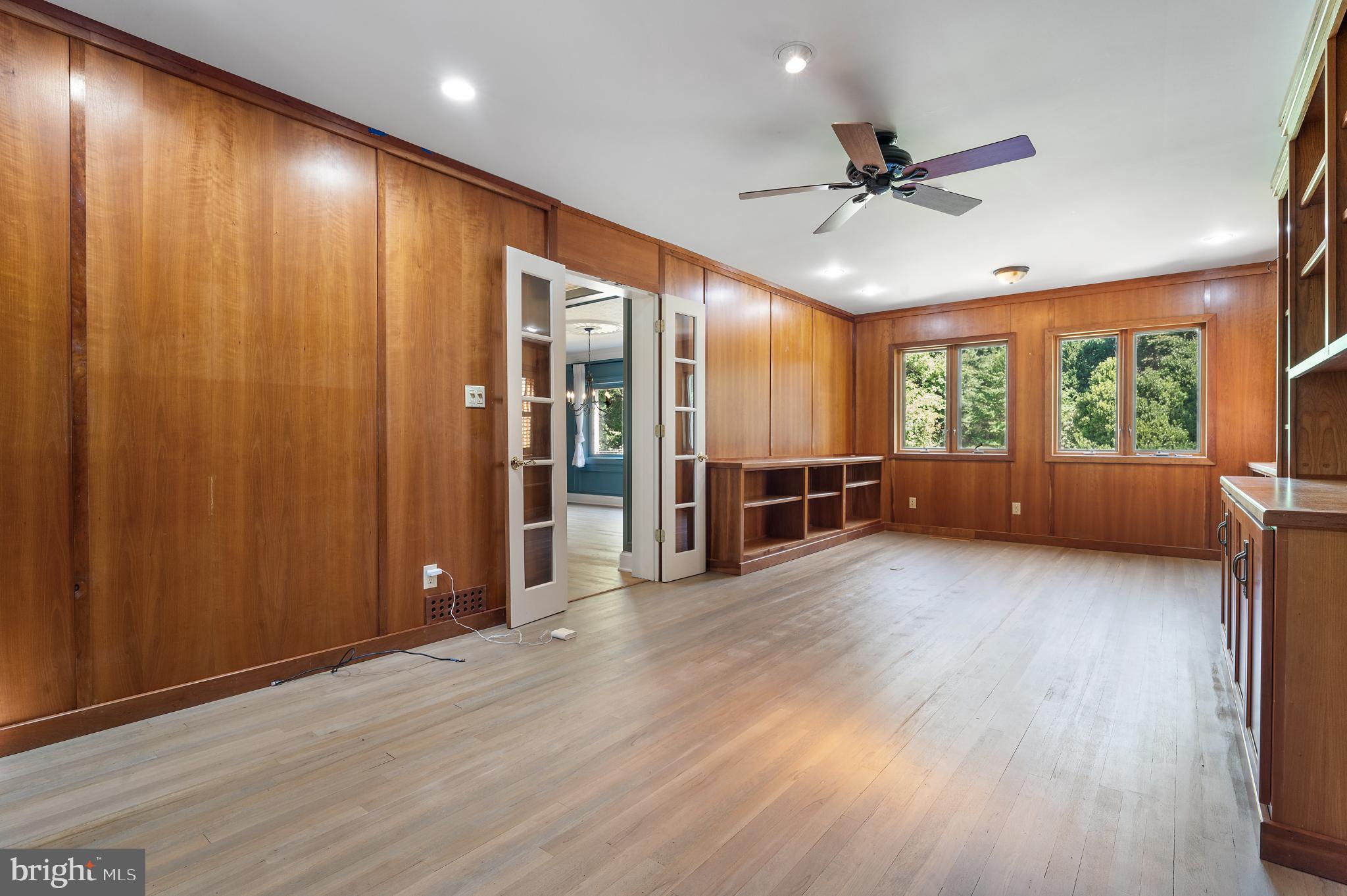 15729 Holly Grove Road Silver Spring, MD 20905 - Photo 24 of 83 a living room with hardwood floor and windows