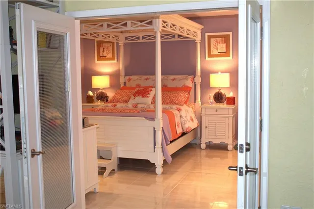 a bed room with a bed and a mirror