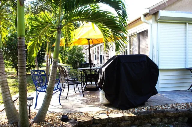 a view of balcony with furniture and potted plants
