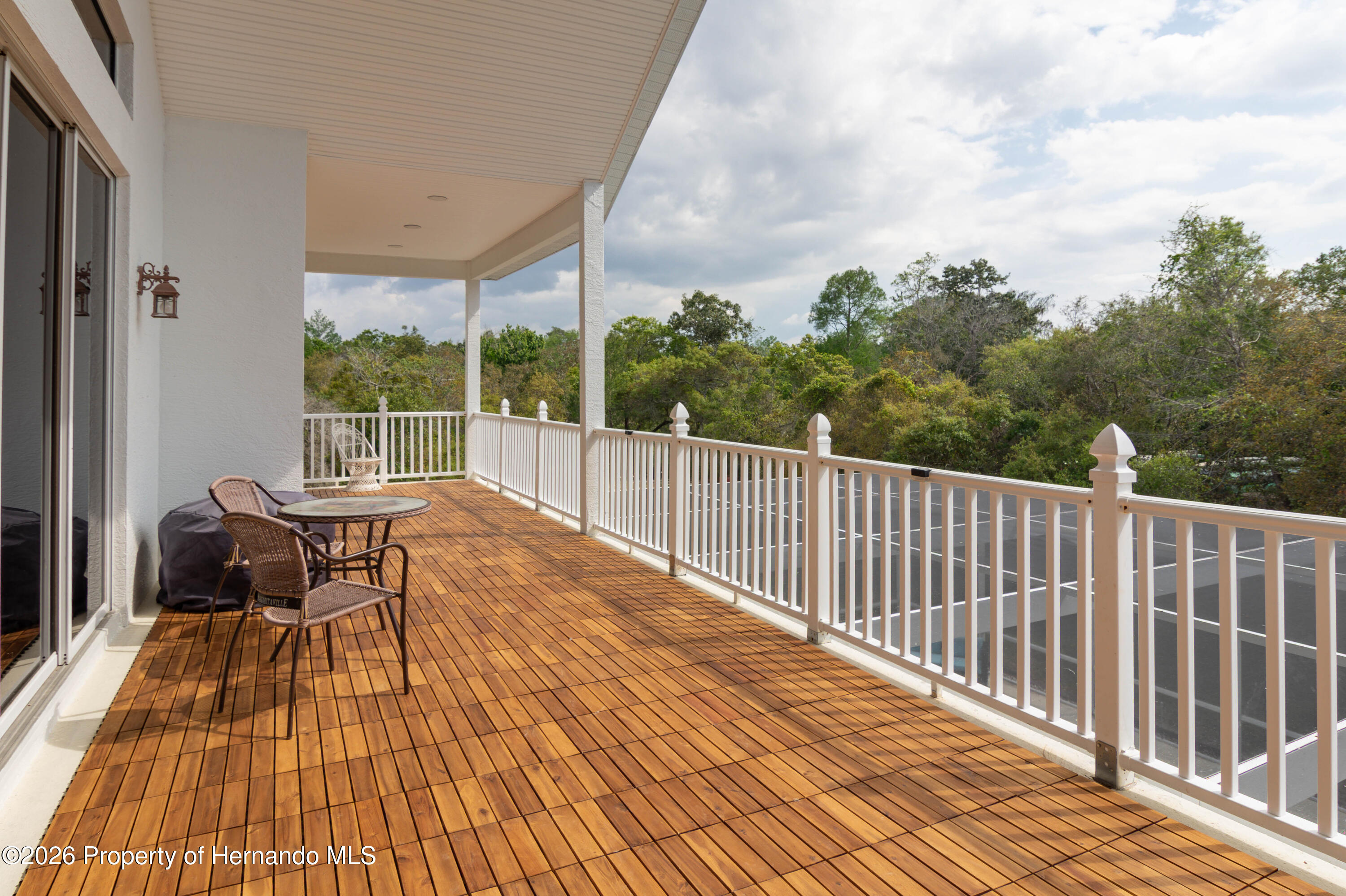 6151 New Osprey Point Weeki Wachee, FL 34607 - Photo 35 of 60 PORCH OFF OF THE FAMILY ROOM