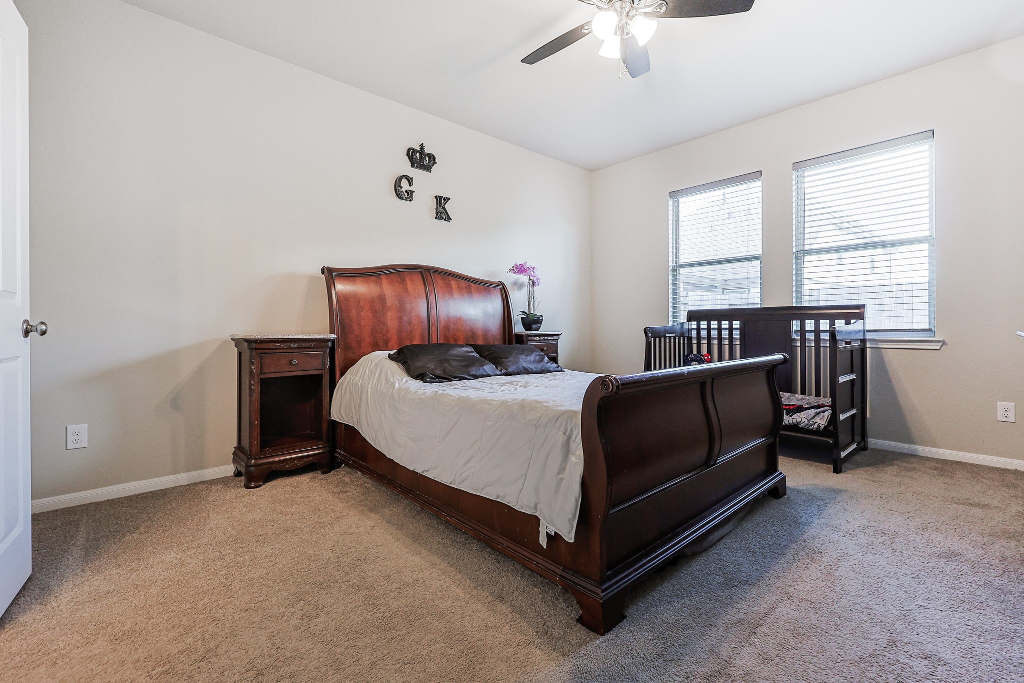 10423 Rochester Hls Lane Tomball, TX 77375 - Photo 18 of 36 The expansive layout easily accommodates a full set of large bedroom furniture, while high ceilings and a central ceiling fan enhance the open, airy feel of the room.
