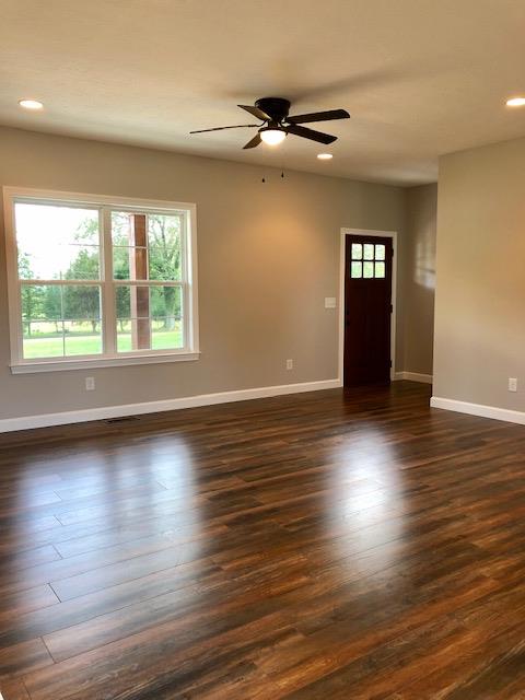 353 Lear Road Portland, TN 37148 - Photo 4 of 14 an empty room with wooden floor and windows