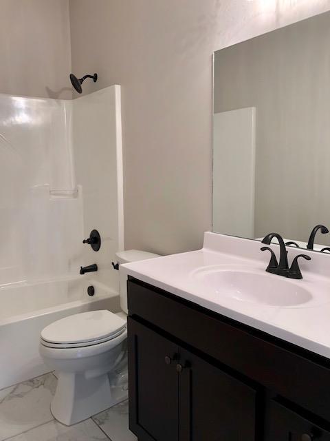 353 Lear Road Portland, TN 37148 - Photo 7 of 14 a bathroom with a sink a toilet and shower