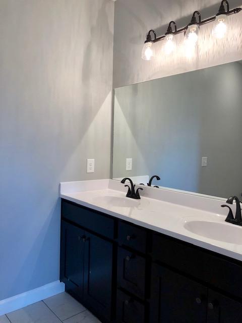 353 Lear Road Portland, TN 37148 - Photo 10 of 14 a bathroom with a double vanity sink and a mirror
