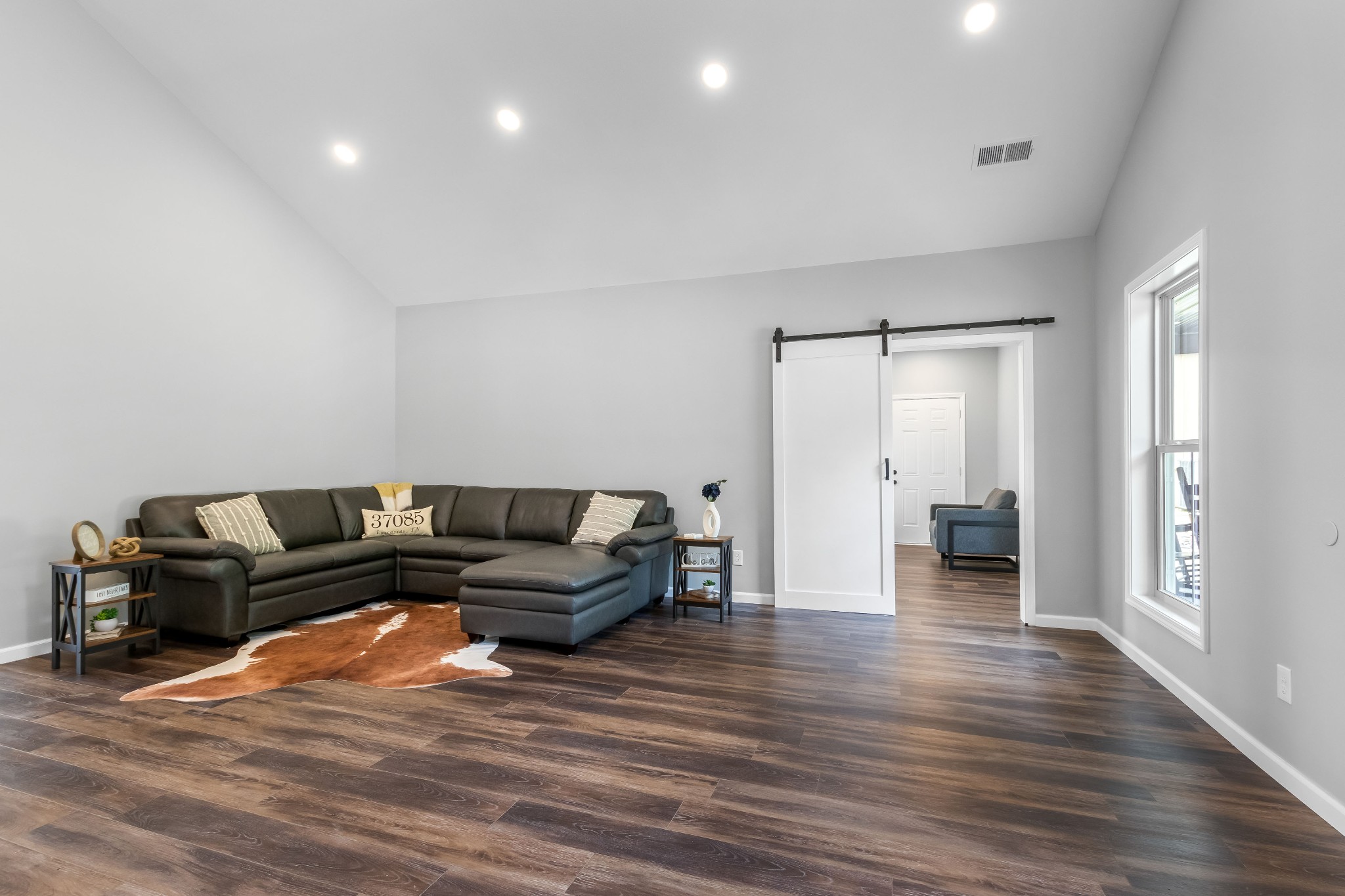 1049 Oregon Road Lascassas, TN 37085 - Photo 27 of 99 a living room with furniture and a wooden floor