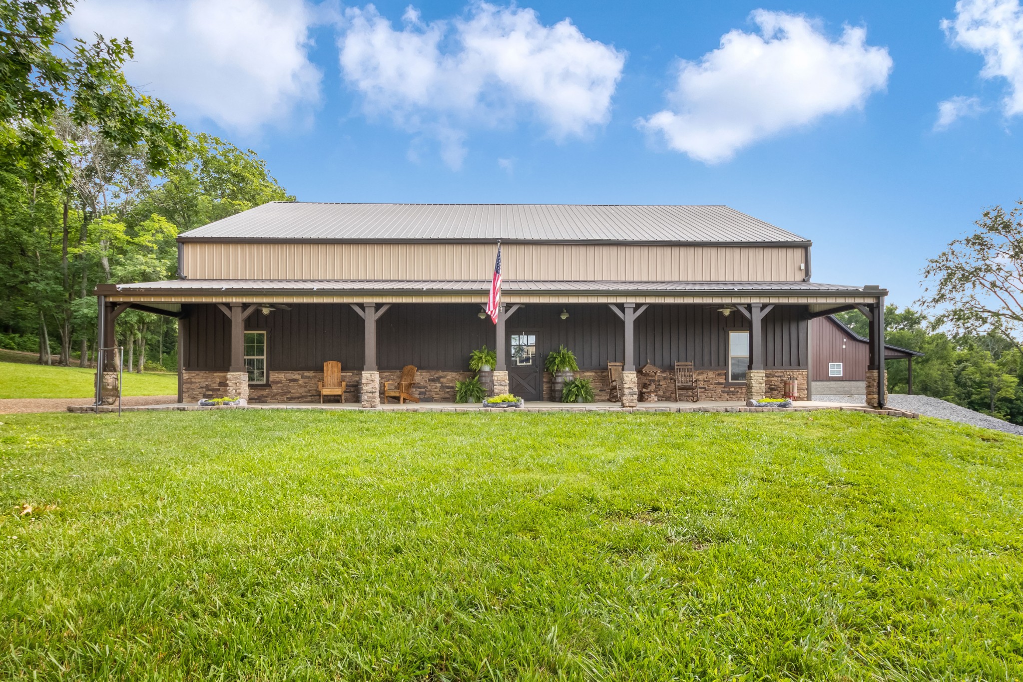 1049 Oregon Road Lascassas, TN 37085 - Photo 48 of 99 a front view of a house with a garden and porch