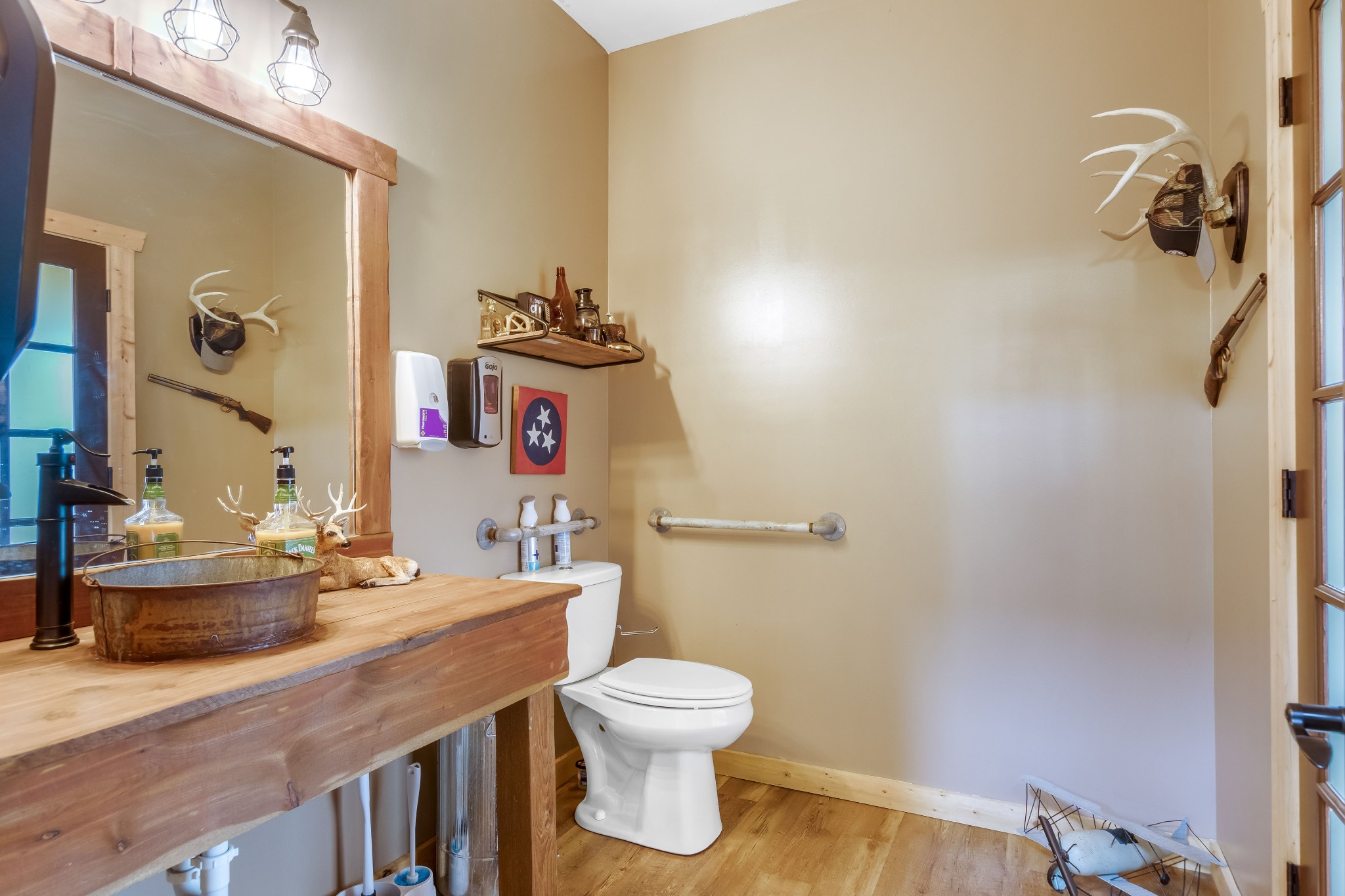 1049 Oregon Road Lascassas, TN 37085 - Photo 70 of 99 a bathroom with a granite countertop sink a toilet and a mirror