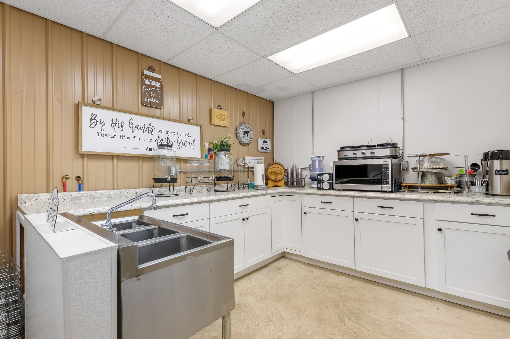 1049 Oregon Road Lascassas, TN 37085 - Photo 73 of 99 a kitchen with stainless steel appliances granite countertop a stove and a sink