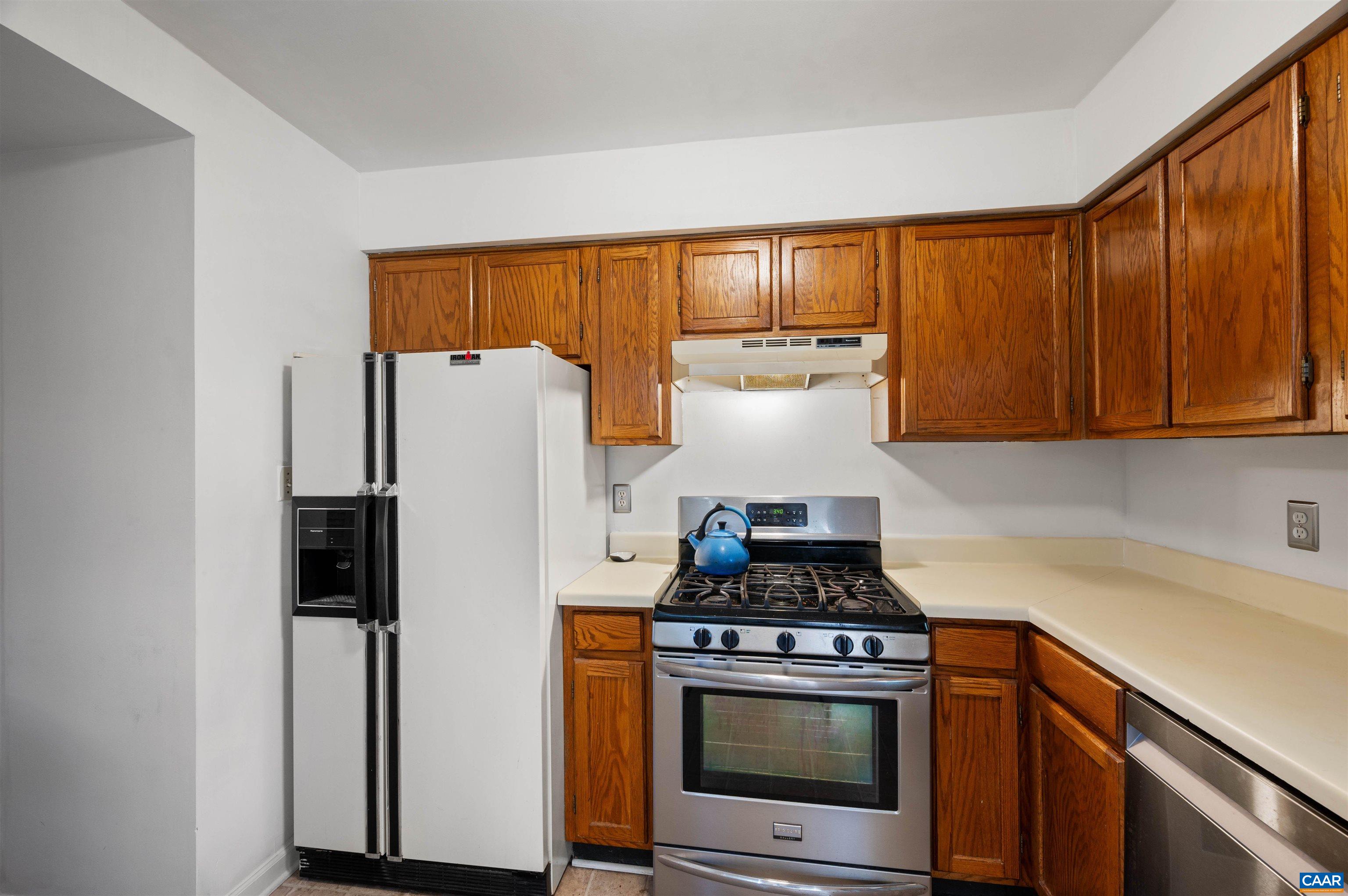 1404 Minor Ridge Court Charlottesville, VA 22901 - Photo 17 of 34 a kitchen with stainless steel appliances granite countertop a refrigerator and a stove top oven