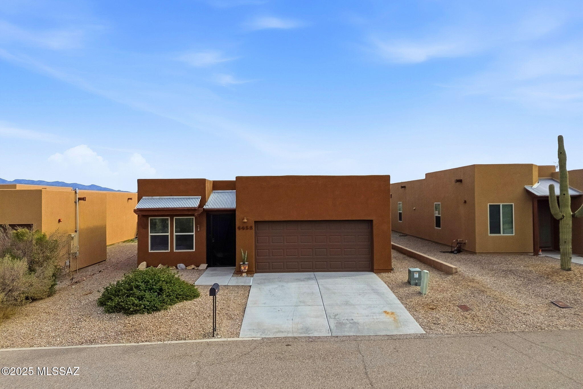 1458 North Wentworth Road Vail, AZ 85641 - Photo 4 of 44 a front view of a house with a yard