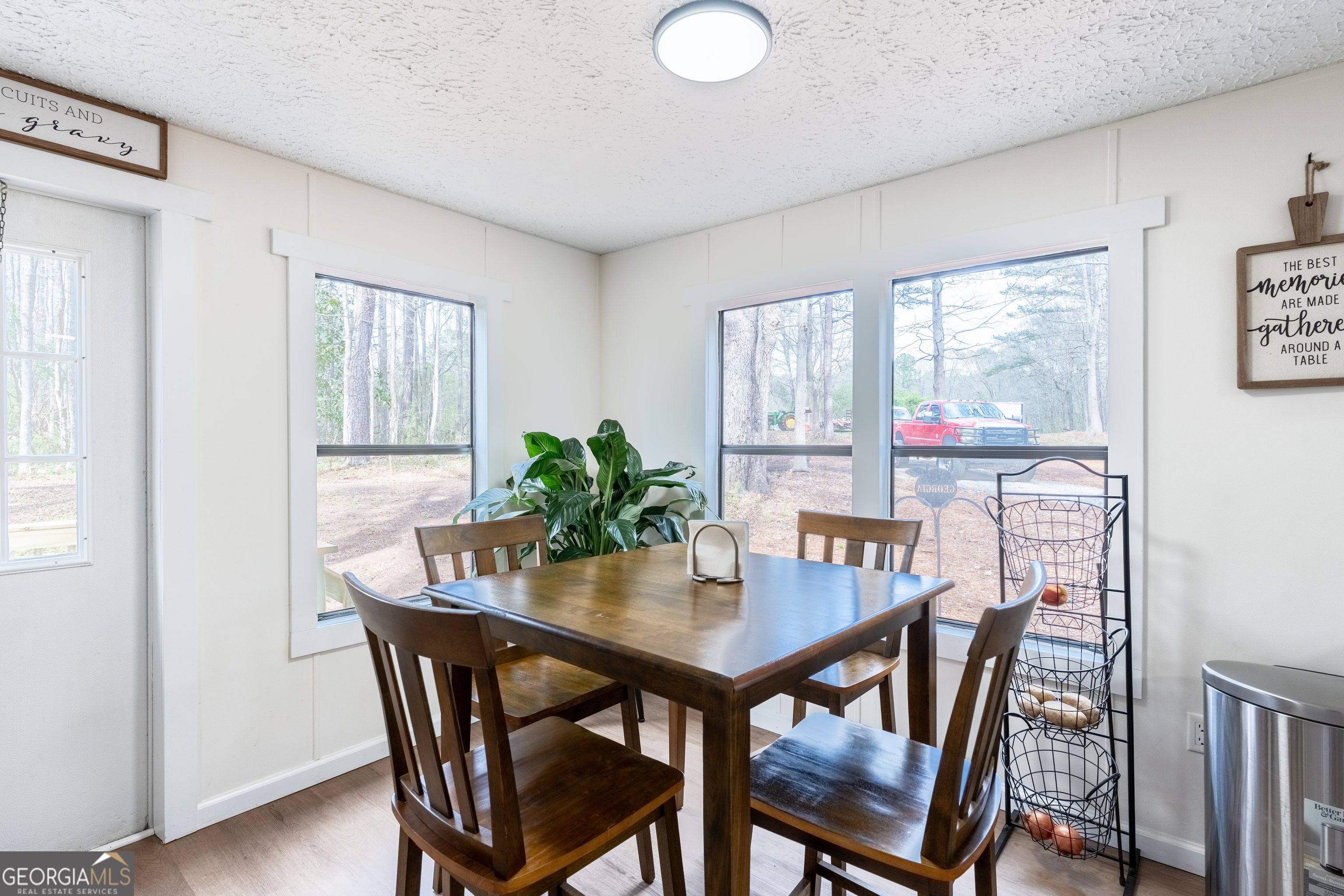 452 Aikenton Road Monticello, GA 31064 - Photo 16 of 47 a view of a dining room with furniture window and outside view