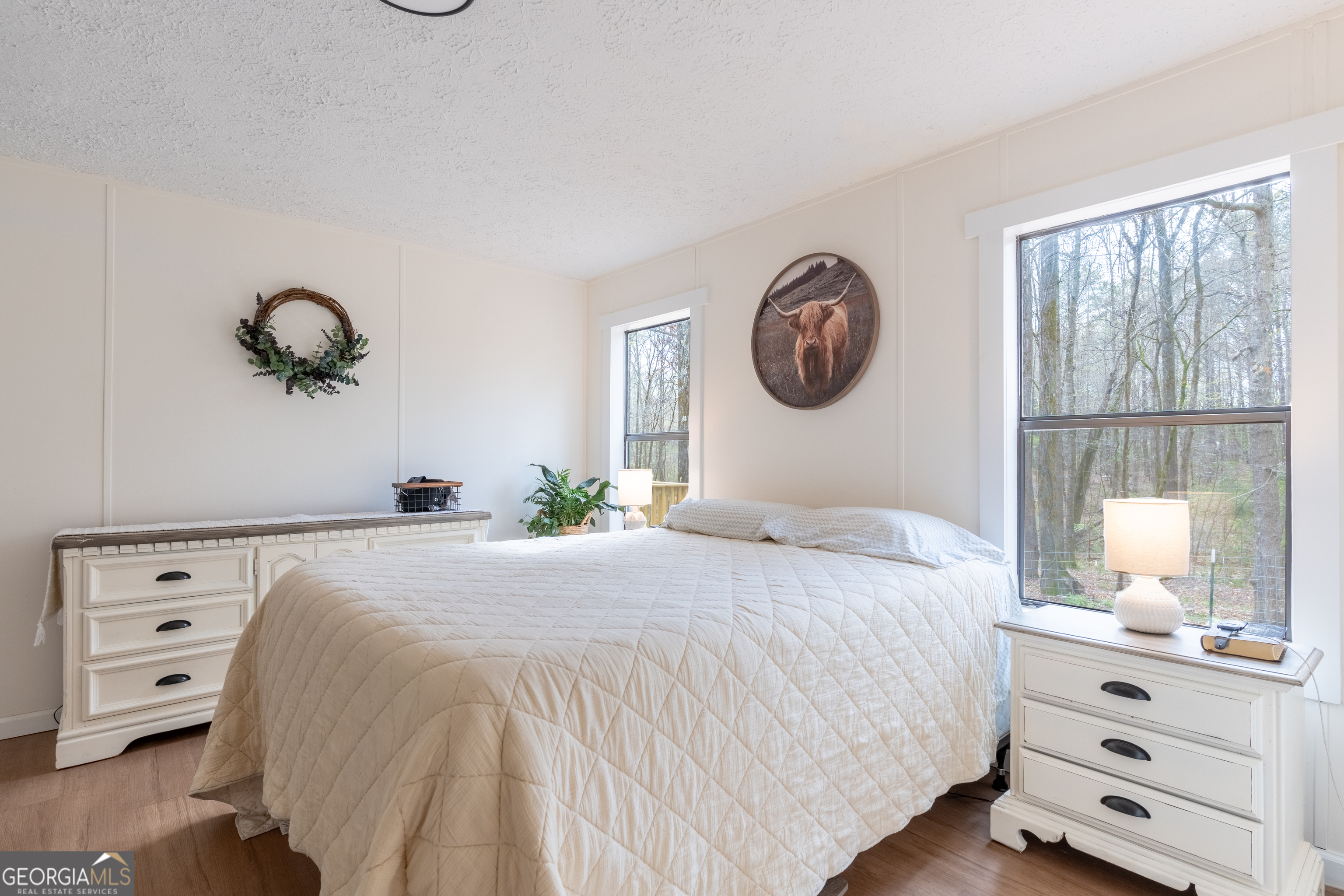 452 Aikenton Road Monticello, GA 31064 - Photo 20 of 47 a bedroom with a bed and a window