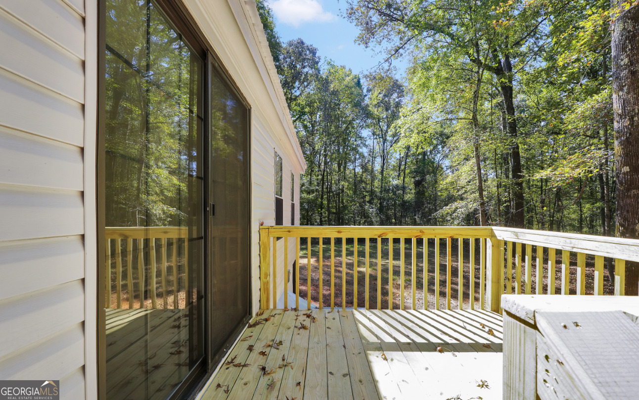452 Aikenton Road Monticello, GA 31064 - Photo 31 of 47 a balcony view with a garden