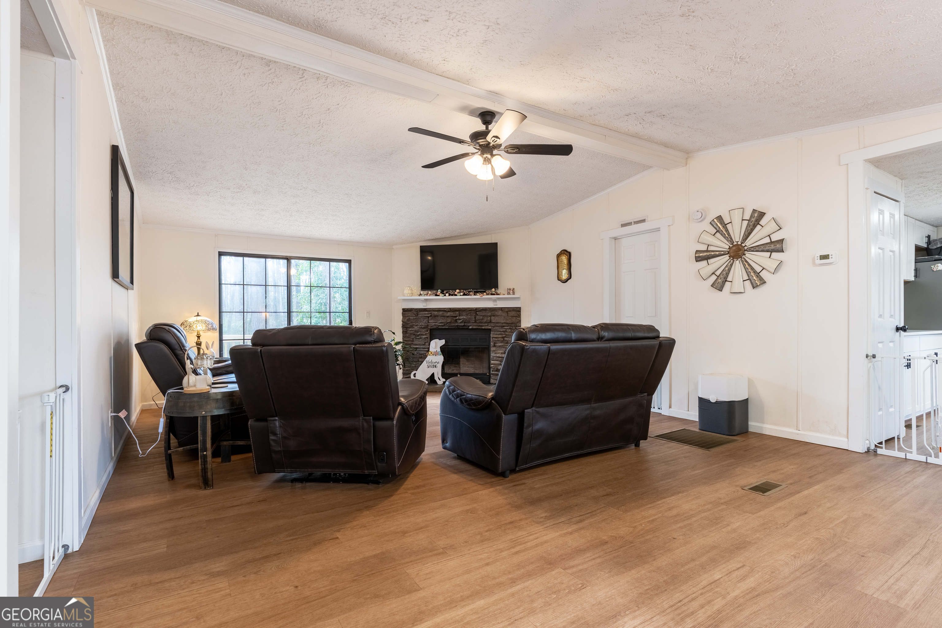 452 Aikenton Road Monticello, GA 31064 - Photo 4 of 47 a living room with furniture and a flat screen tv