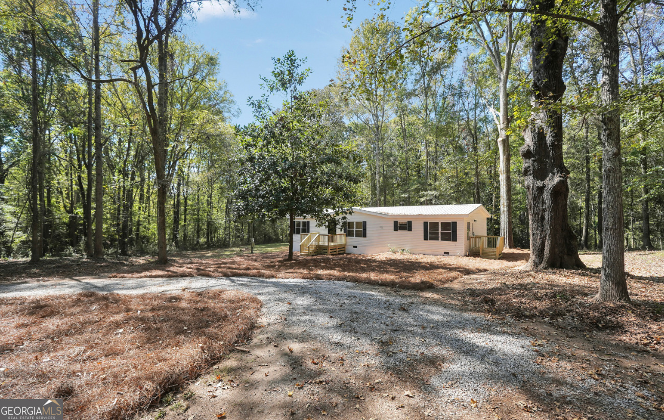 452 Aikenton Road Monticello, GA 31064 - Photo 44 of 47 a view of a house with a yard and tree
