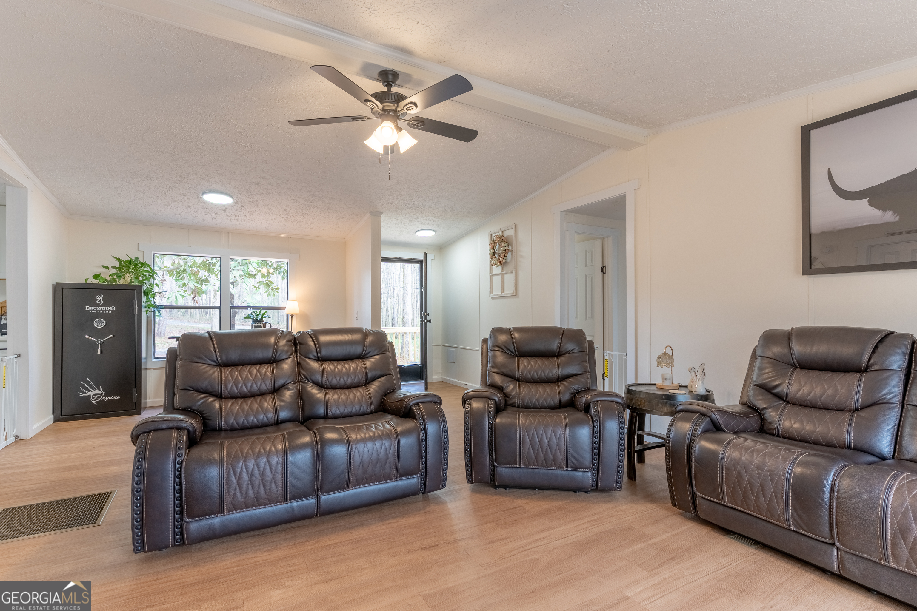 452 Aikenton Road Monticello, GA 31064 - Photo 6 of 47 a living room with furniture and a flat screen tv