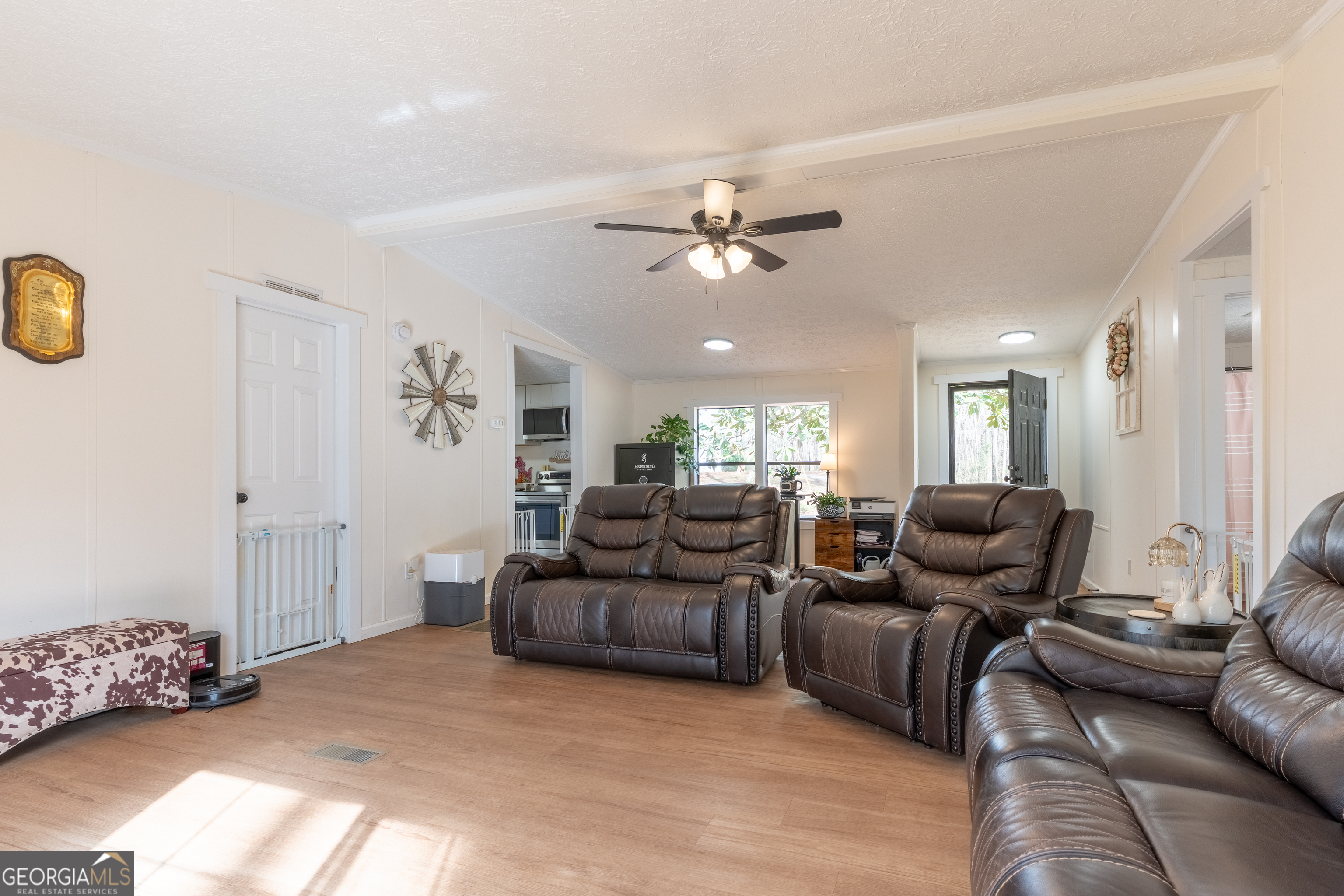 452 Aikenton Road Monticello, GA 31064 - Photo 7 of 47 a living room with furniture and a chandelier