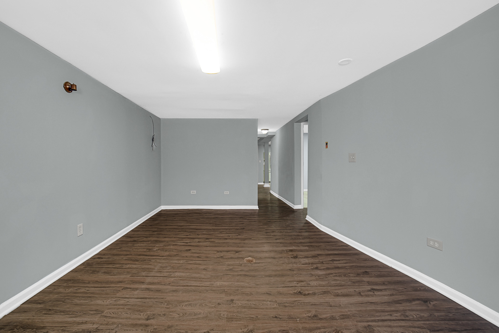 5540 South Honore Street Chicago, IL 60636 - Photo 14 of 23 a view of an empty room with wooden floor