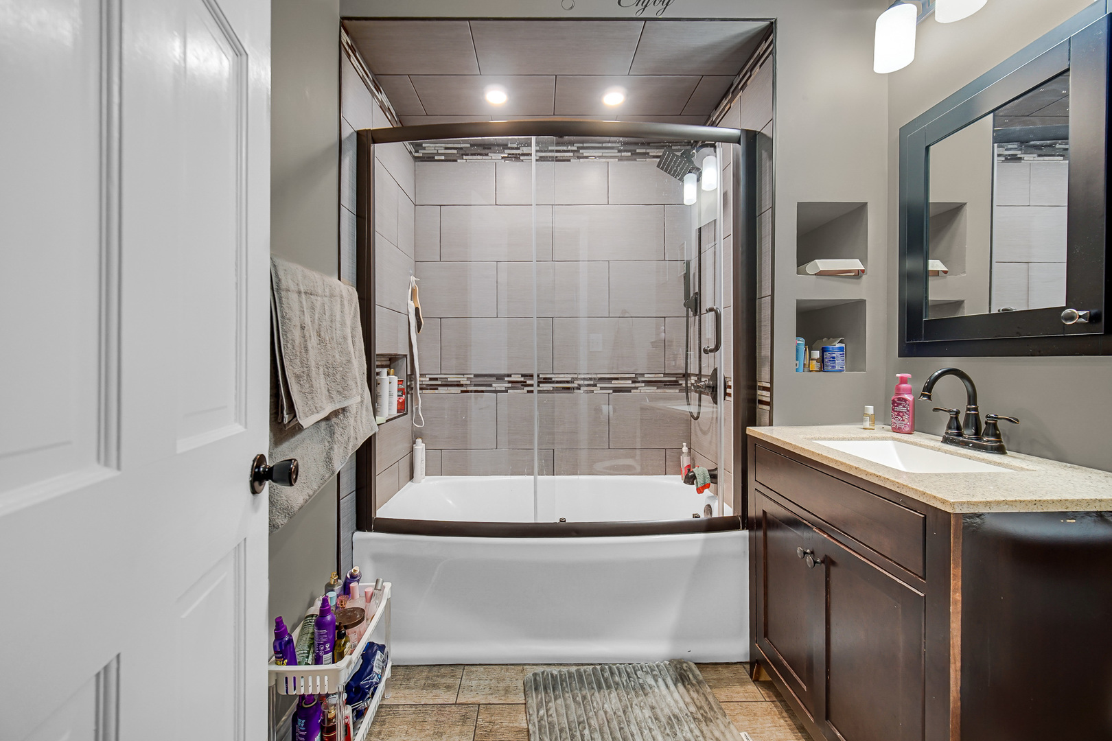 5540 South Honore Street Chicago, IL 60636 - Photo 6 of 23 a bathroom with a sink a toilet and shower