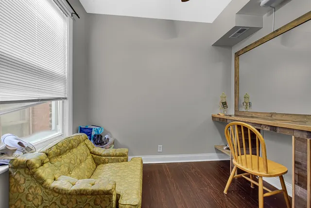 a view of balcony with wooden floor