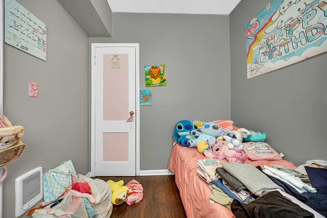 a bedroom with a bed and toys