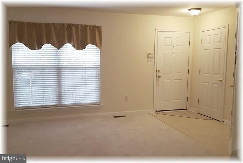 721 Shallow Ridge Court Abingdon, MD 21009 - Photo 2 of 28 Step inside to your spacious living room.