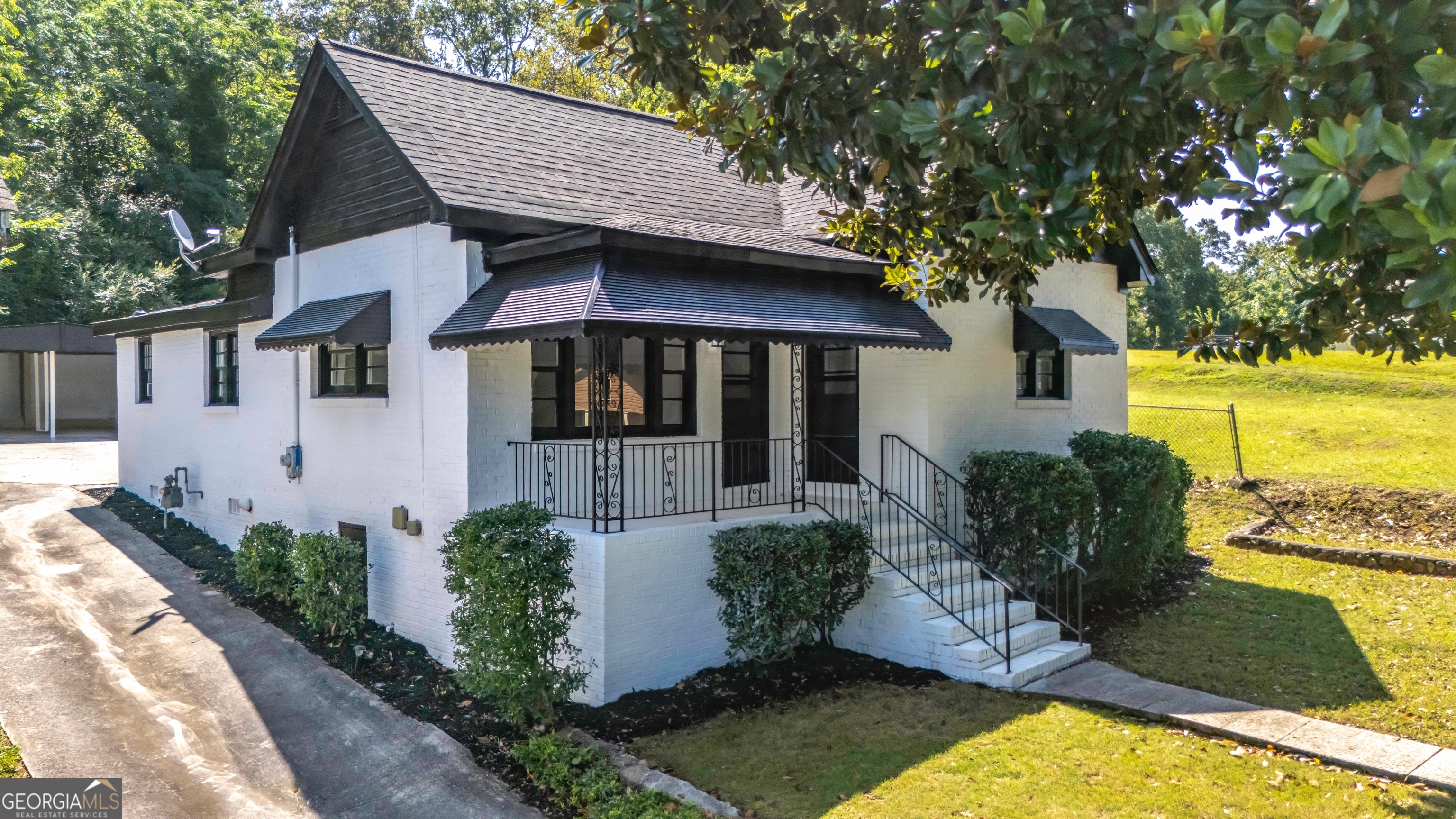 a front view of a house with a yard