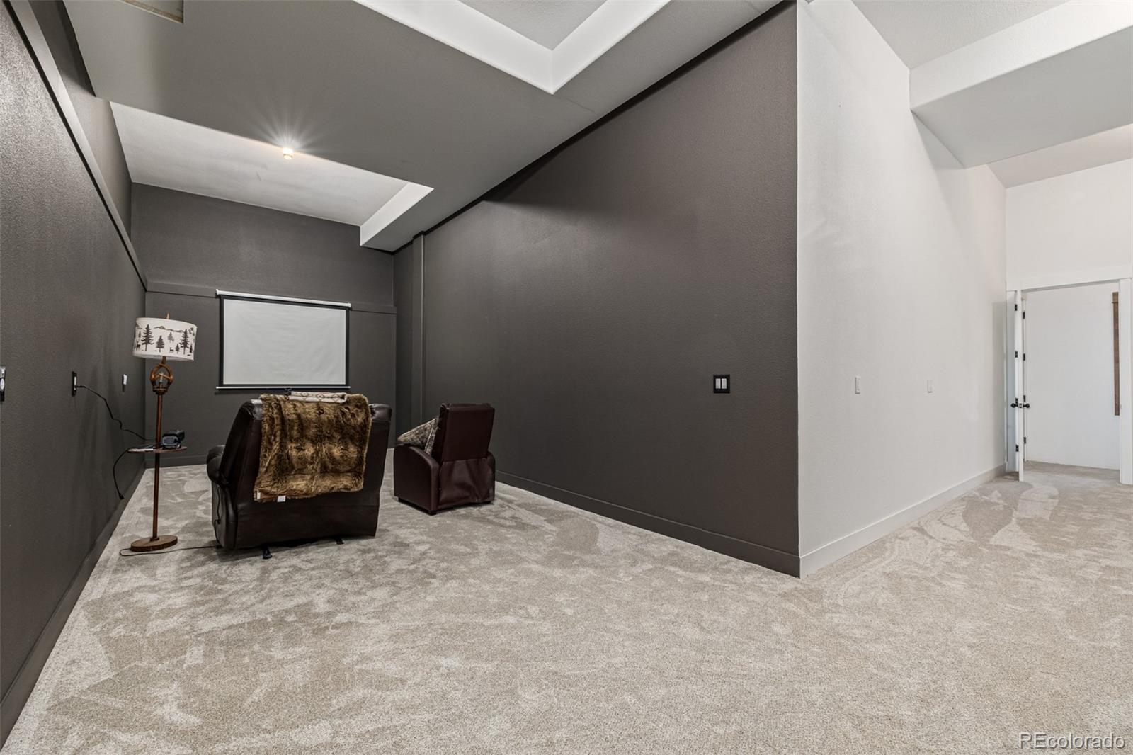 663 Brookside Drive Bailey, CO 80421 - Photo 34 of 47 a bedroom with a bed and a couch
