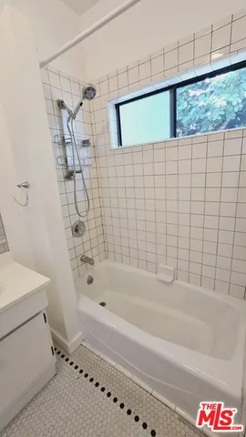 a bathroom with a sink and a bathtub