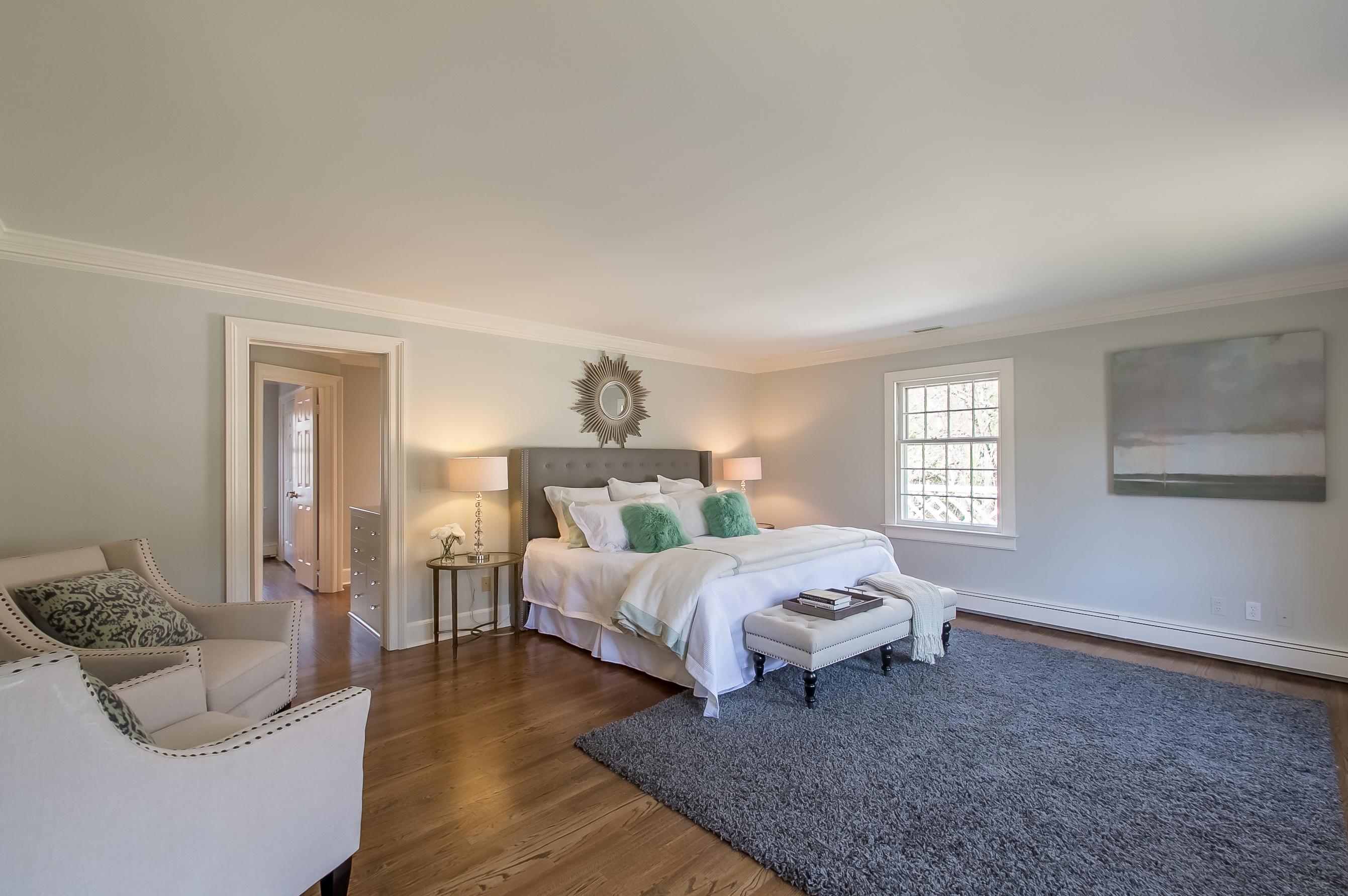 Undisclosed Address Wilton, CT 06897 - Photo 23 of 30 a bedroom with a bed and window