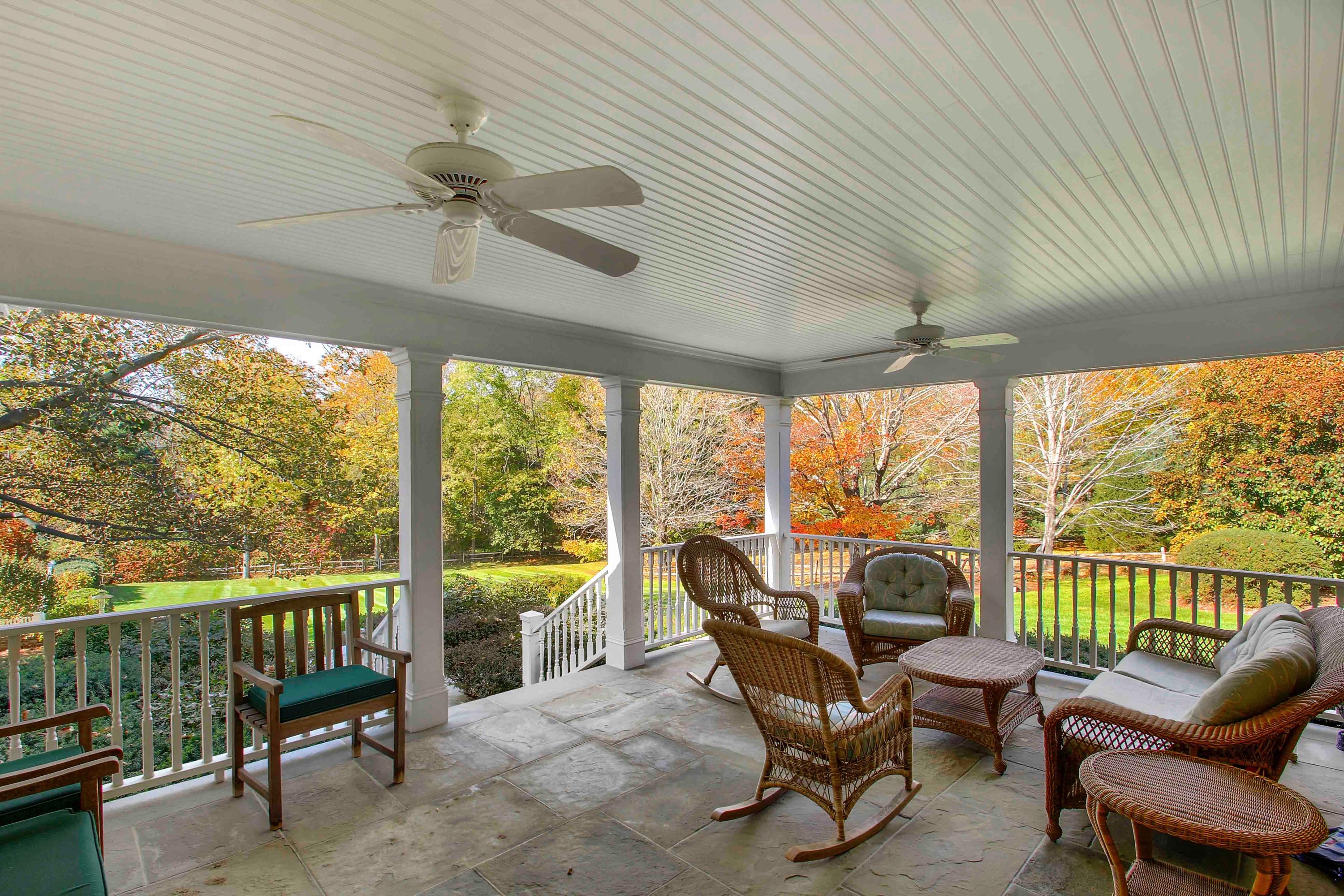 Undisclosed Address Wilton, CT 06897 - Photo 3 of 30 a view of a porch with furniture