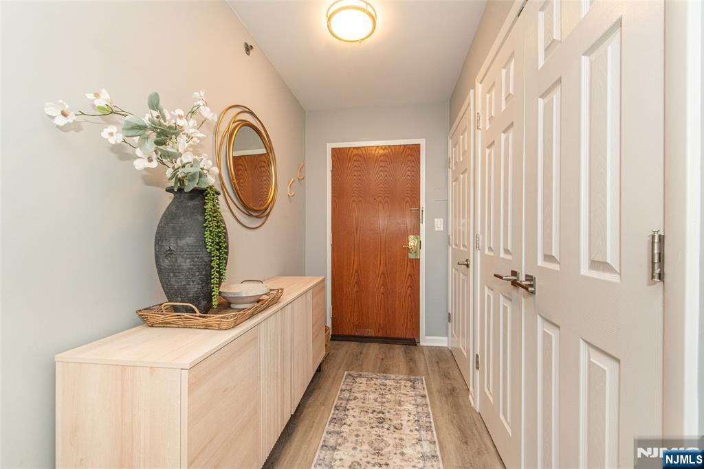 300 Main Street, Unit 211 Little Falls, NJ 07424 - Photo 2 of 30 a very nice looking room with a mirror