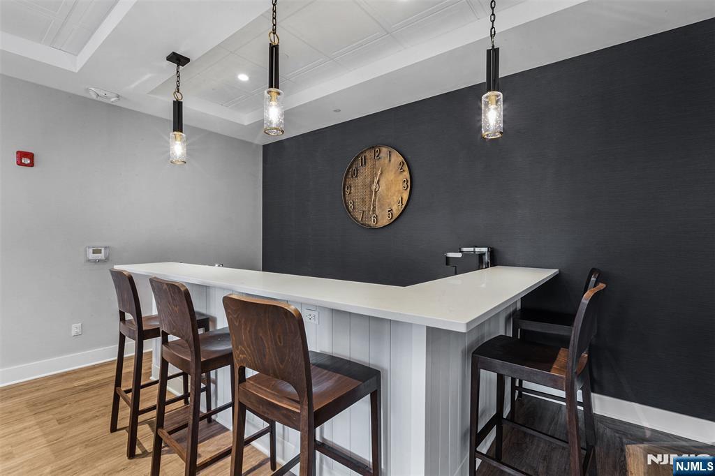 300 Main Street, Unit 211 Little Falls, NJ 07424 - Photo 27 of 30 a view of a dining room and a table chairs