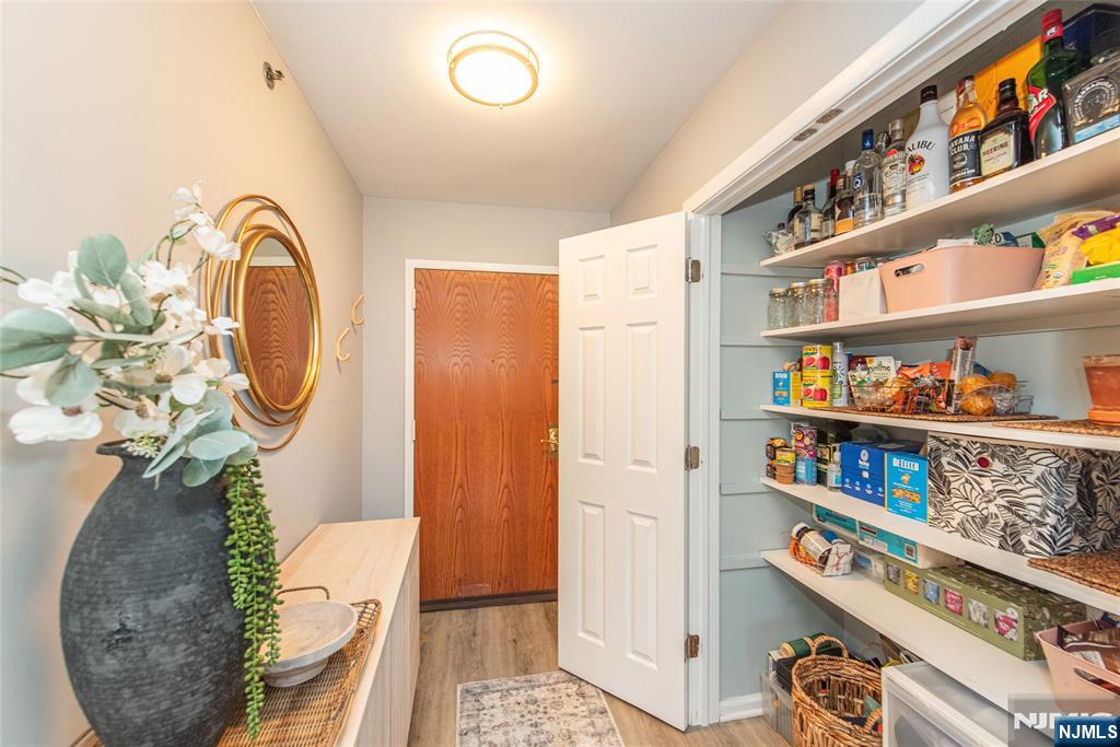 300 Main Street, Unit 211 Little Falls, NJ 07424 - Photo 3 of 30 a picture of a room with lots of stuff and toys