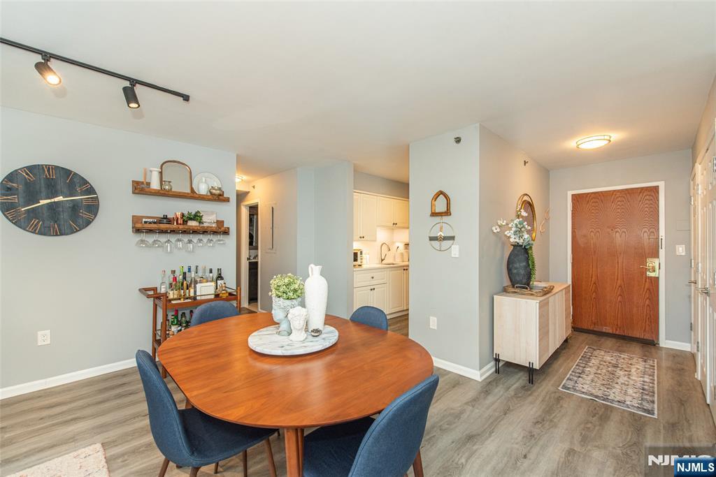 300 Main Street, Unit 211 Little Falls, NJ 07424 - Photo 4 of 30 a view of a dining room with furniture