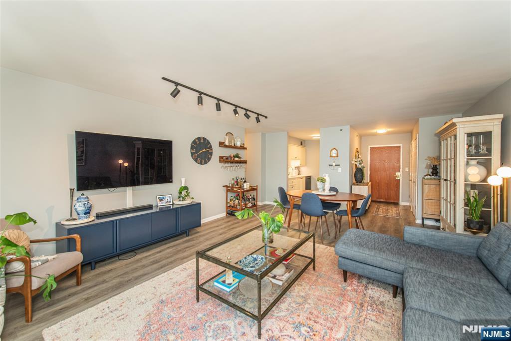 300 Main Street, Unit 211 Little Falls, NJ 07424 - Photo 7 of 30 a living room with furniture and a flat screen tv