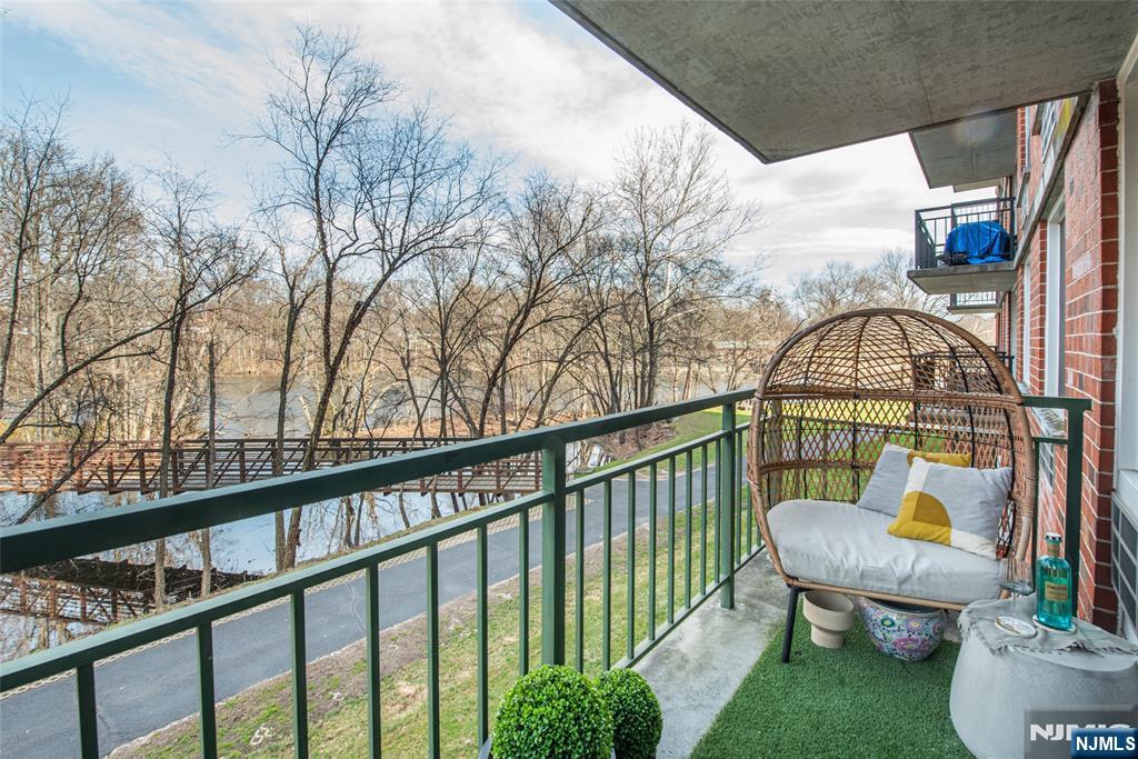 300 Main Street, Unit 211 Little Falls, NJ 07424 - Photo 10 of 30 a view of a balcony with furniture