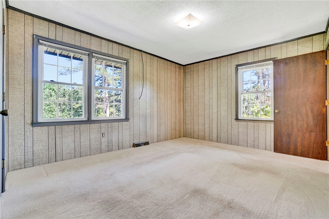 7876 Highway 11 Walhalla, SC 29691 - Photo 28 of 35 A quiet bedroom offering tree-filled views through its multiple windows.