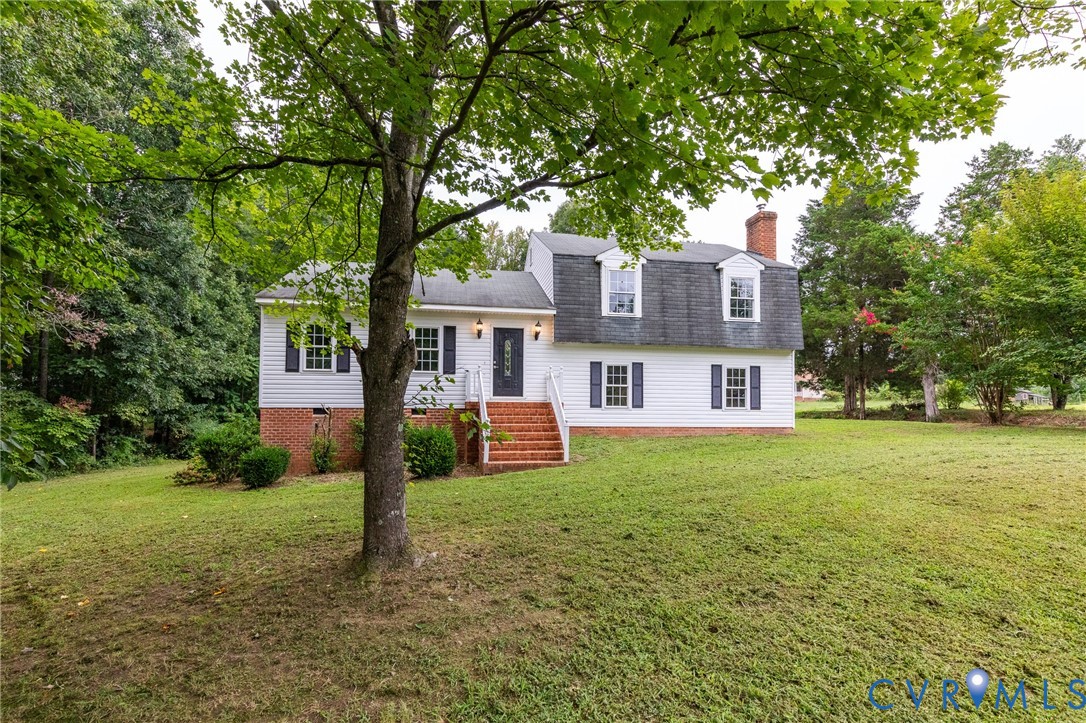 14050 West Patrick Henry Road Doswell, VA 23047 - Photo 4 of 38 Tri-level home featuring a chimney, a front yard,